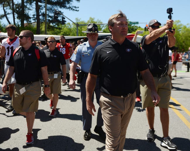 Georgia Head Coach Kirby Smart, center, walks the dawg walk during the annual G-Day game at Sanford Stadium on Saturday, April 16, 2016 in Athens, Ga. (Richard Hamm/Staff) OnlineAthens / Athens Banner-Herald
