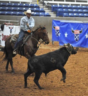 Andrew Napp works a young steer preparing for the United States Team Roping Championships' Panhandle Classic roping event on Thursday at the Amarillo National Center on the Tri-State Fairgrounds. Amarillo Chamber of Commerce President/CEO Gary Molberg said losing tourism would mean diminishing the economic diversification established in this area.