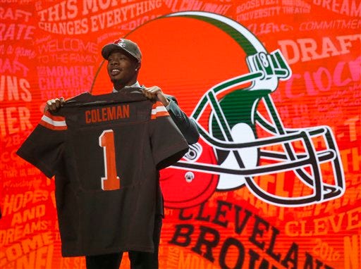 Baylor’s Corey Coleman poses for photos after being selected by Cleveland Browns as the 15th pick in the first round of the 2016 NFL football draft, Thursday, April 28, 2016, in Chicago. (AP Photo/Charles Rex Arbogast)