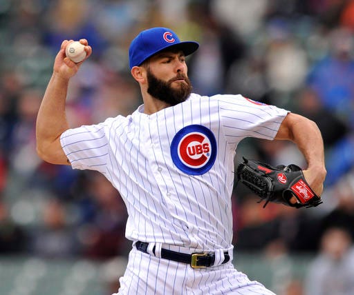 Chicago Cubs starter Jake Arrieta delivers a pitch during the first inning of a baseball game against the Milwaukee Brewers Thursday, April 28, 2016, in Chicago. (AP Photo/Paul Beaty)