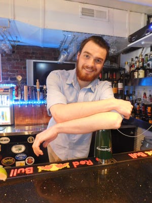 Bartender Jonathan Ripley at Fat Belly's in Portsmouth  Photo by Karen Dandurant