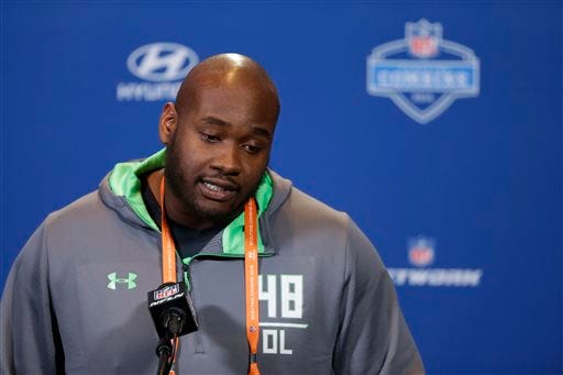 FILE - In this Feb. 24, 2016 file photo, Mississippi offensive lineman Laremy Tunsil speaks during a press conference at the NFL football scouting combine in Indianapolis. Former Mississippi left tackle Laremy Tunsil had a good chance to be the NFL draft's No. 1 overall pick less than two weeks ago when the Tennessee Titans had the pick. Then the Los Angeles Rams traded up for the No. 1 pick in search of a quarterback. Now Tunsil's future is much more uncertain. (AP Photo/Michael Conroy, File)