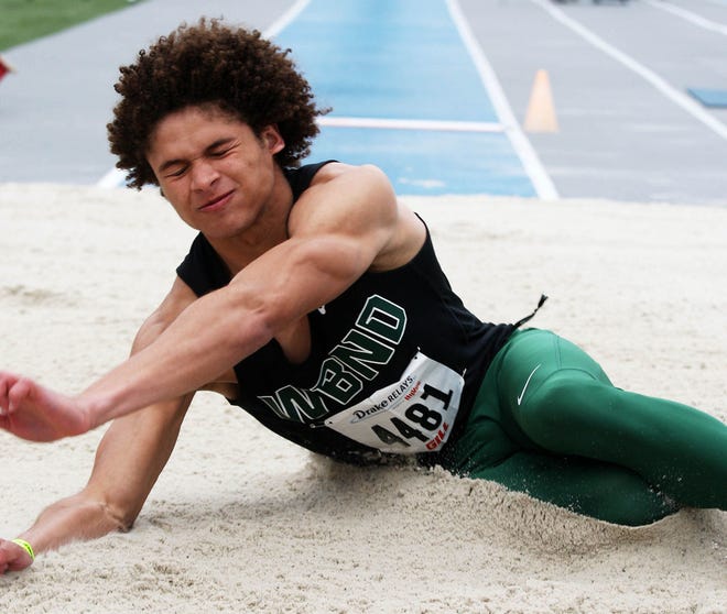 West Burlington-Notre Dame’s Xavior Williams lands in the pit during the long jump at the Drake Relays in Des Moines. Wiliams will be a key contributor as the Falcons seek a second straight team championship in Class 2A.