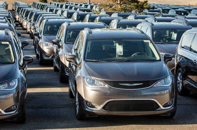 Provided by FCA US The parking lot at the Palace of Auburn Hills (Mich.) is filled with more than 200 Chrysler Pacifica minivans on Wednesday as Michigan-area dealers take part in the company's largest drive-away event.