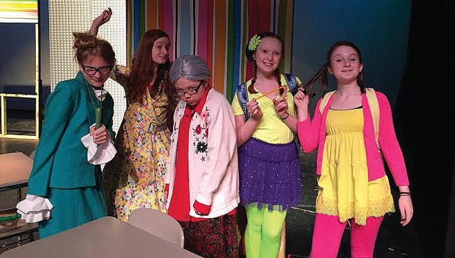The Sky View Middle School Drama Club will perform Sideways Stories from Wayside School in the Masschusetts Educational Theater Guild's Middle School One-Act Play Competition on May 1. Part of the cast pictured on set are (left to right): Katelyn Wright as "Mrs. Pickle," Emma Waterhouse as "Mrs. Jewls," Malie Marino as "Mrs. Gorf," Marilyn Wilson as "Bebe," and Abby Waterhouse as "Leslie."