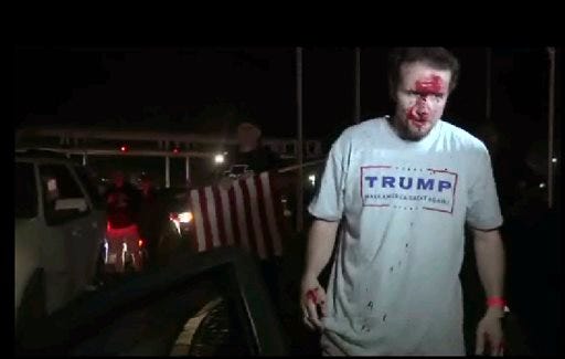 This still image taken from video shows a supporter of Republican presidential candidate Donald Trump after a protest on Thursday, April 28, 2016 in Costa Mesa, Calif. Dozens of protesters were mostly peaceful Thursday as Trump gave his speech inside the Pacific Amphitheater. After the event, however, the demonstration grew rowdy late in the evening and spilled into the streets.
