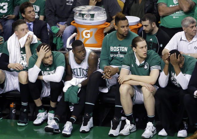 Members of the Celtics watch as the final seconds tick away on their season after the Atlanta Hawks won Game 6, Thursday, and the best-of-7 series, 4-2. The Associated Press
