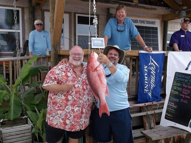 The third annual Fudpucker’s Fishing Series is scheduled to start May 7. Pictured here is Chester Kroeger, also known as Father Fud, along with angler Kerry Veach with a red snapper he weighed during last year’s fishing series.