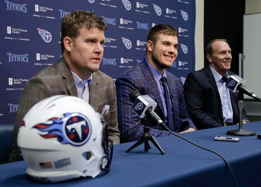 Michigan State offensive tackle Jack Conklin, center, the Tennessee Titans' top draft pick, appears at a news conference with Titans' general manager Jon Robinson, left, and head coach Mike Mularkey, right, on Friday, April 29, 2016, in Nashville, Tenn. (AP Photo/Mark Humphrey)