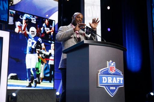 Former Walter Payton Men of the Year Reggie Wayne announces that the Indianapolis Colts selects Texas Tech’s Le'Raven Clark as the 82nd pick in the third round of the 2016 NFL football draft, Friday, April 29, 2016, in Chicago. (AP Photo/Charles Rex Arbogast)