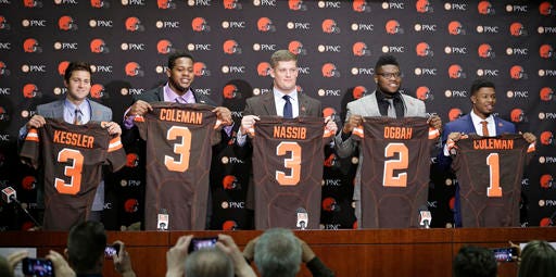 Cleveland Browns' Cody Kessler, left to right, Shon Coleman, Carl Nassib, Emmanuel Ogbah and Corey Coleman hold up their jerseys at a news conference at the NFL football team's training camp facility, Saturday, April 30, 2016, in Berea, Ohio. (AP Photo/Tony Dejak)