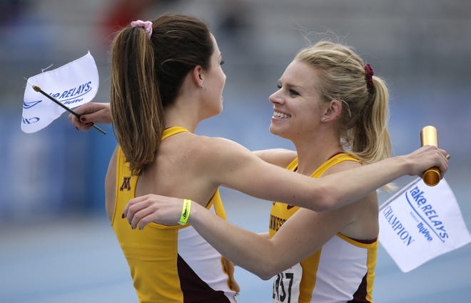 Minnesota's Madeline Strandemo, left, celebrates with teammate Kaila Urick, right, after anchoring their 1600-meter relay team to victory at the Drake Relays athletics meet, Thursday, April 28, 2016, in Des Moines, Iowa. (AP Photo/Charlie Neibergall)