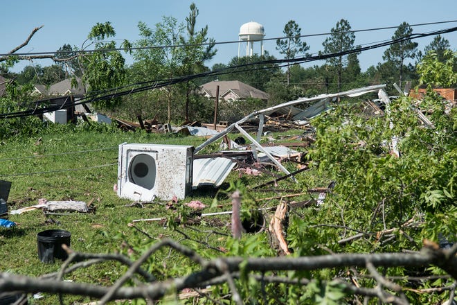 Household items and debris are scattered along land between houses on Farm-to-Market 16 in Lindale, Texas, Saturday, April, 30, 2016 after severe weather including a possible tornado Friday night. (Sarah A. Miller/Tyler Morning Telegraph)