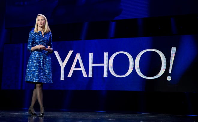 FILE - In this Jan. 7, 2014, file photo, Yahoo president and CEO Marissa Mayer speaks during the International Consumer Electronics Show in Las Vegas. Mayer will walk away with a $55 million severance package if the company's auction of its Internet operations culminates in a sale that ousts her from her job. The payout disclosed in a Friday, April 29, 2016, regulatory filing consists of cash, stock awards and other benefits that Mayer would get should she be forced out as CEO within a year after a sale. (AP Photo/Julie Jacobson, File)