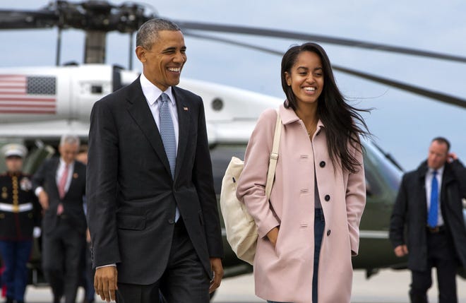FILE - In a Thursday, April 7, 2016 file photo, President Barack Obama jokes with his daughter Malia Obama as they walk to board Air Force One from the Marine One helicopter, as they leave Chicago en route to Los Angeles. The White House announced Sunday, May 1, 2016, that Malia Obama will take a year off after high school and attend Harvard University in 2017.

(AP Photo/Jacquelyn Martin, File)