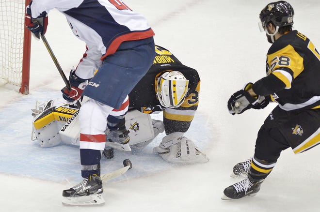 Penguins goalie Matthew Murray makes a stop on the Washington Capitals Jay Beagle (83) during the first period of Game 3 of the Pittsburgh Penguins second-round playoff series against the Washington Capitals at Consol Energy Center in Pittsburgh.
