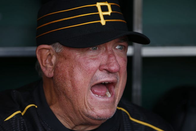 Pirates manager Clint Hurdle sits in the dugout before a baseball game against the Cincinnati Reds on Sunday. Hurdle said Monday he doesn't separate the Cubs from other teams the Pirates are playing because “Every series is big, because it’s the big leagues.”