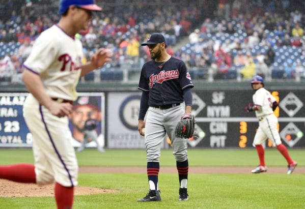 Indians starter Danny Salazar looks away after being called for a balk in the third inning, which allowed the Phillies' Peter Bourjos, left, to score.