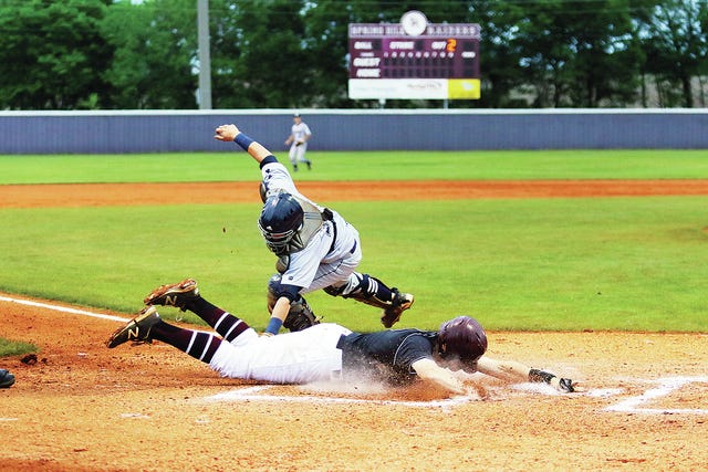 Spring Hill's Matt Joslin slides home as Independence catcher Beaux Escobar makes a late tag in Monday's game at Spring Hill. (Photo by correspondent Vanessa Beach)