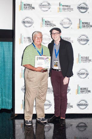 Tom Bennett, left, accepts an award at the Nashville Film Festival Scriptwriters Competition from Josh Escue, competition manager for the festival. Submitted by Tom Bennett.