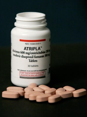 Atripla, a fixed-dose once-a-day tablet for the treatment of HIV-1, is shown at the National Press Club in Washington, Wednesday, July 12, 2006. (AP Photo/Haraz N. Ghanbari)