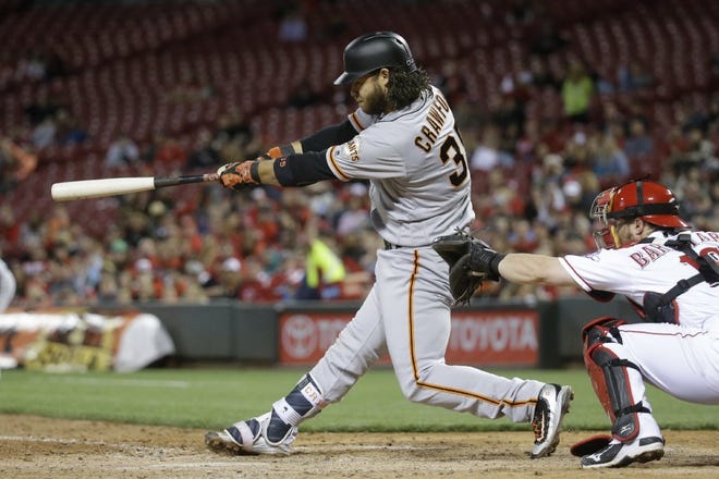 The Giants' Brandon Crawford hits a go-ahead, three-run home in the seventh inning.