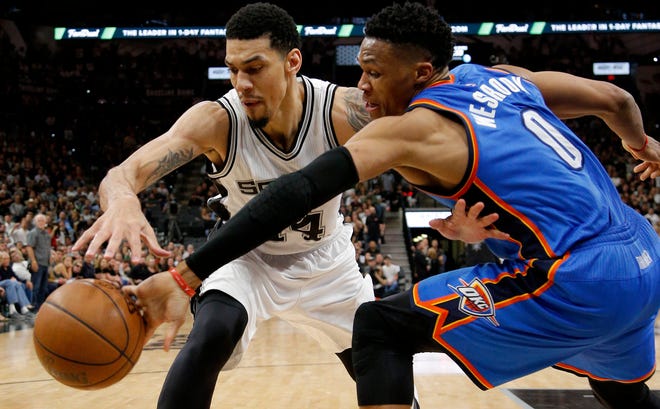 Oklahoma City's Russell Westbrook (0) goes for the ball beside San Antonio's Danny Green (14) during Game 2 of the second-round series between the Oklahoma City Thunder and the San Antonio Spurs in the NBA playoffs at the AT&T Center in San Antonio, Monday, May 2, 2016. Oklahoma City won 98-97. Photo by Bryan Terry, The Oklahoman