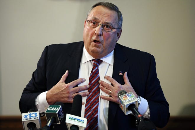 In this Jan. 8, 2016 file photo, Maine Gov. Paul LePage speaks at a news conference at the State House, in Augusta, Maine. A federal judge on Tuesday, May 3, 2016, dismissed a lawsuit accusing LePage of using blackmail to force a charter school operator to rescind a job offer to a political opponent in a flap that roiled the Legislature and led to an impeachment effort. AP Photo/Robert F. Bukaty, File