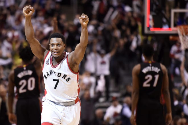 Toronto Raptors' Kyle Lowry (7) reacts after making a buzzer-beater 3-pointer to force overtime with the Heat in Game 1 on Tuesday night. Miami rebounded for a 102-96 win. AP Photo
