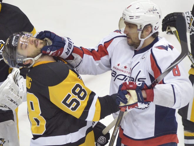 The Washington Capitals' Alex Ovechkin (8) shoves Kris Letang (58) during the first period of Game 3 of the Pittsburgh Penguins second-round playoff series against the Washington Capitals at Consol Energy Center in Pittsburgh.