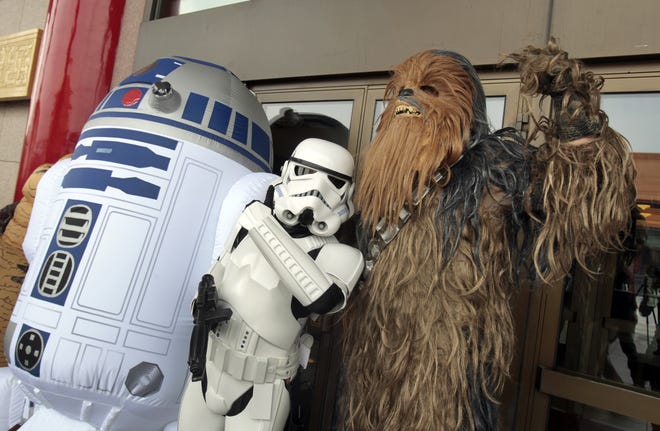 Fans dressed as movie Star Wars characters to cerebrate on the Star Wars Day in Taipei, Taiwan, Wednesday, May 4, 2016. (AP Photo/Chiang Ying-ying)