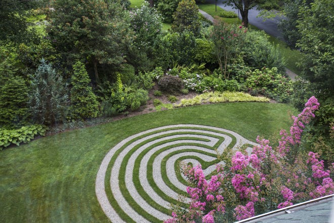 Chevy Chase, Maryland, homeowner Vicky Baily installed a labyrinth in her yard for herself and neighbors to enjoy. The labyrinth required two dump trucks of topsoil, 2,240 square feet of sod (some of which went on the outside of the labyrinth), 2 tons of stone dust and 1.5 tons of river gravel, and cost $13,000, Baily estimates. MUST CREDIT: Photo by April Greer for The Washington Post.