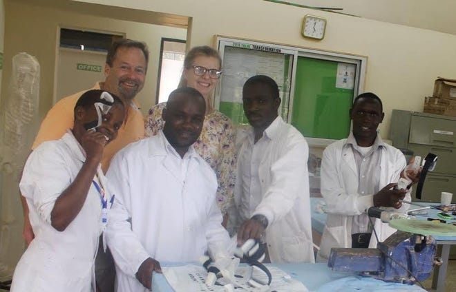 Wells Prosthetist Jerald Cunningham and daughter Jordan with staff at the CURE International hospital in Kenya.

Courtesy photo