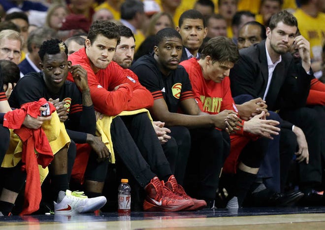 Atlanta players on the bench watch as Cleveland built a 74-38 halftime lead on Wednesday. The Hawks trail the Cavaliers 2-0 in their series.