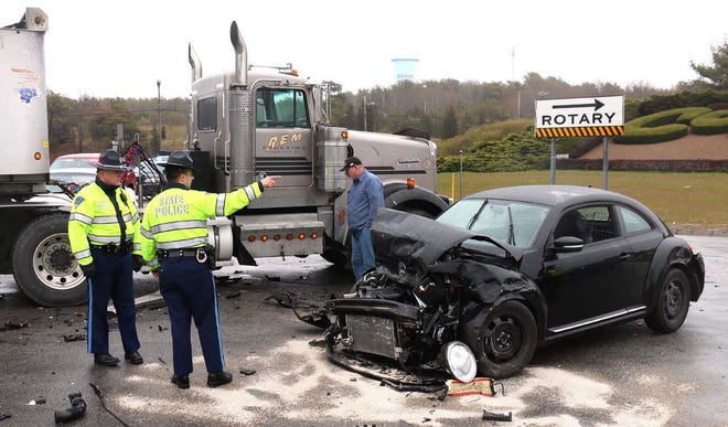 Two people were injured in a three-vehicle crash at the base of the Bourne Bridge shortly after noon.