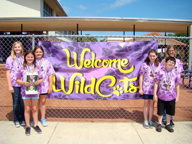 Chisholm Elementary's Odyssey of the Mind team members Madelyn Schneider, Serenity Skinner, Alize Cardot, Zoe Metchick, Janna Bradley and Matthew Melanson show of their state champion trophy and medals.