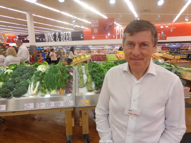 Ian McLeod, president and CEO of Southeastern Grocers, the parent company for Winn-Dixie grocery stores, visits the newly renovated Winn-Dixie store in DeBary, which has been converted into the chain's new format. NEWS-JOURNAL/AUSTIN FULLER