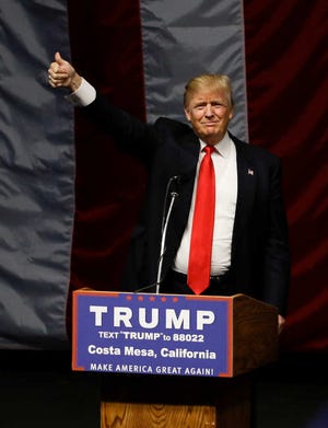 Republican presidential candidate Donald Trump arrives for a rally, Thursday, April 28, 2016 in Costa Mesa, Calif. (AP Photo/Chris Carlson)
