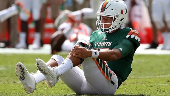 OCTOBER 24: Brad Kaaya #15 of the Miami Hurricanes is injured after a sack during a game against the Clemson Tigers at Sun Life Stadium on October 24, 2015 in Miami Gardens, Florida. (Photo by Mike Ehrmann/Getty Images)