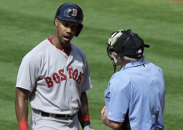 Boston Chris Young, left, has words with home plate umpire Tom Hallion after striking out against the Astros on April 23 in Houston. Brought in to face lefties, the reserve outfielder hasn't seen much playing time this season.