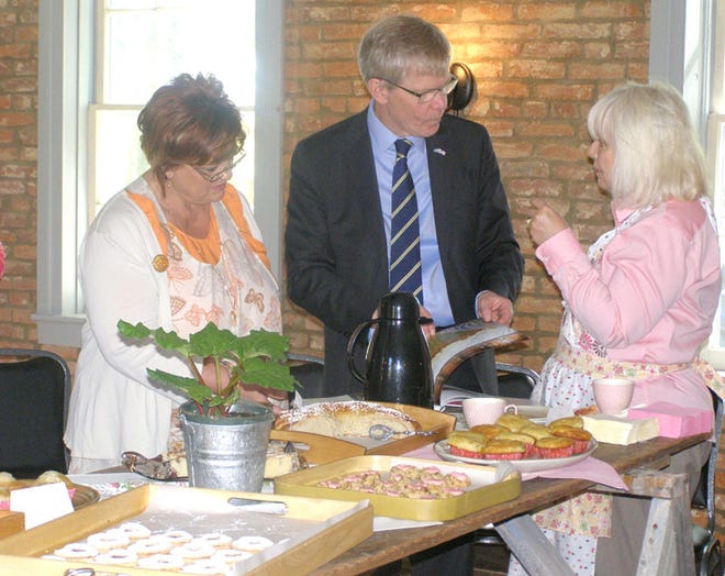 Swedish Ambassador to the U.S., Björn Lyrvall, chats with Deni Menken, right, president of the Bishop Hill Heritage Association Board of Directors, and Glenda Wallace, manager of the BHHA’s Colony Store, during a visit to Bishop Hill Thursday which began with a coffee in the 1855 Dairy Building.