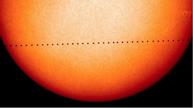 This is a time-elapse photograph of a past transit of Mercury across the Sun, taken every few minutes. (NASA)
