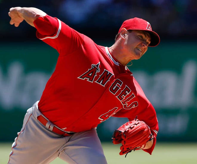 Los Angeles Angels starting pitcher Garrett Richards delivers to the Texas Rangers during the first inning of a game Sunday in Arlington, Texas. (AP Photo/Jim Cowsert)