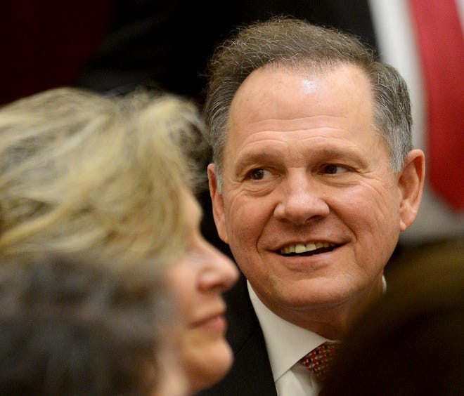 Alabama Chief Justice Roy Moore listens to introductions before he takes his oath of office Friday, Jan. 11, 2013, at the Heflin-Torbert Judicial Building in Montgomery, Ala.(AP Photo/AL.com, Julie Bennett)