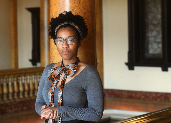 Ciera Young, a 24-year-old college graduate, is among those pushing for a higher minimum wage.