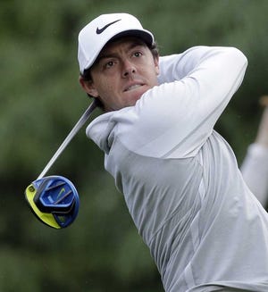Rory McIlroy watches his tee shot on the 11th hole during the first round of the Wells Fargo Championship golf tournament at Quail Hollow Club in Charlotte, N.C., Thursday, May 5, 2016. (AP Photo/Chuck Burton)