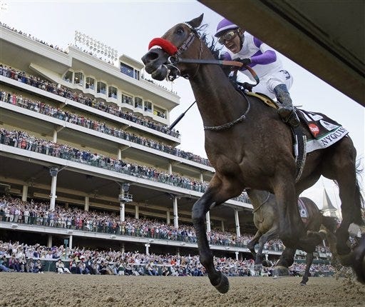 Mario Gutierrez rides Nyquist to victory during the 142nd running of the Kentucky Derby horse race at Churchill Downs on Saturday. AP Photo/David J. Phillip