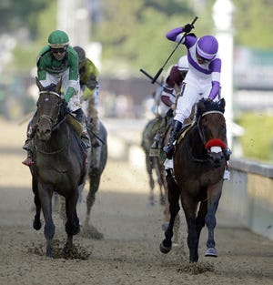 Mario Guitierrez rides Nyquist to victory during the 142nd running of the Kentucky Derby at Churchill Downs on Saturday.