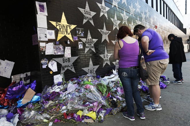 A star honoring Prince, now painted gold, stands out on the wall Thursday, May 5, 2016 as fans gathered at the memorial for the singer at First Avenue in Minneapolis where he often performed. The pop rock singer died on April 21 at the age of 57.