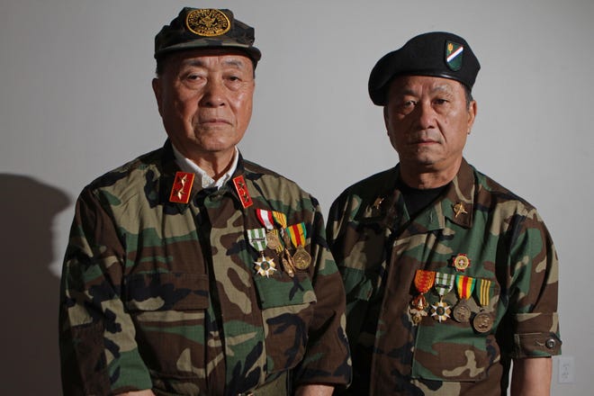 Ger V. Xiong, 73, left, of Johnston, and Toua Kue, 68, of Providence, are Hmong veterans of the U.S. Secret Army Special Guerrilla Unit that fought with U.S. troops during the Vietnam War. The Providence Journal/Steve Szydlowski